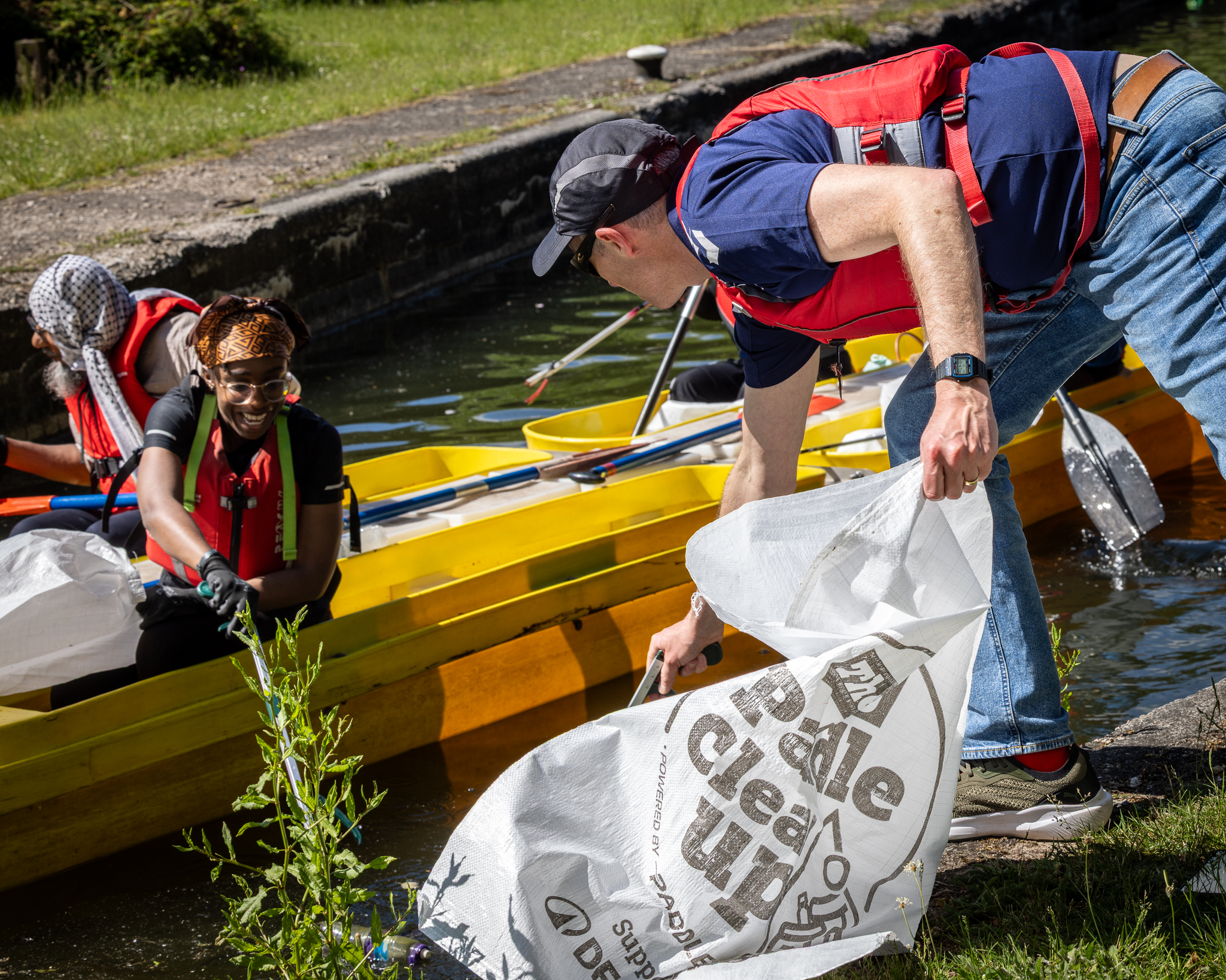 Decathlon UK Big Paddle Cleanup volunteers on the water, CSR event photography by Chris Whittam